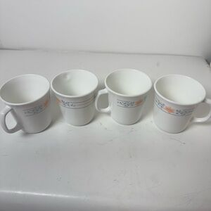 set of four vintage Corning Corelle Apricot Grove coffee mugs.